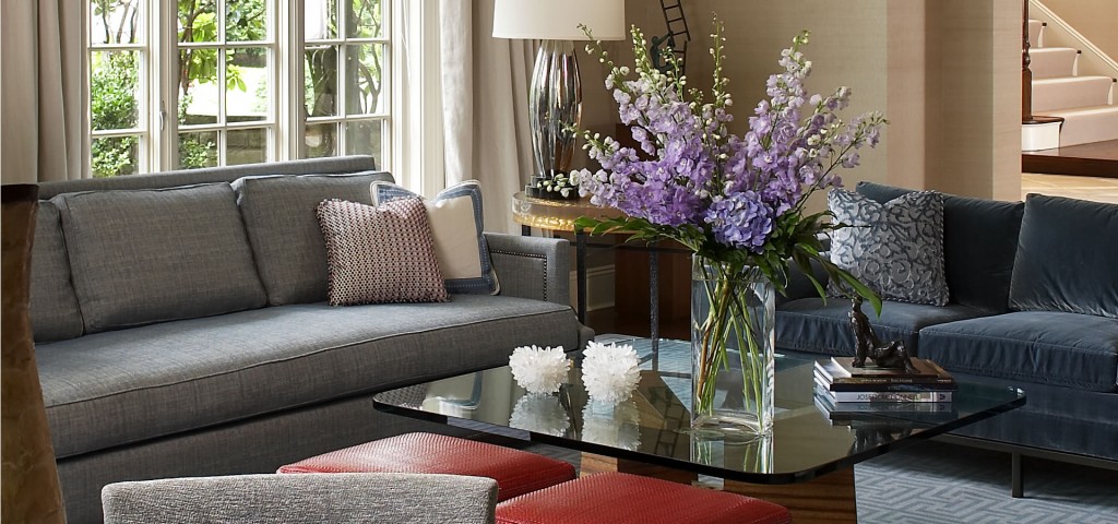 photo of purple flowers in vase on living room coffee table