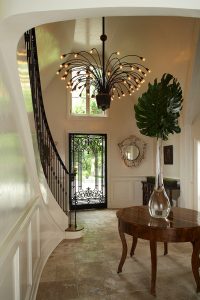 photo of entry way with chandelier that looks like spray of potted plant