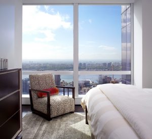 stunning bedroom view with spotted upholstered contemporary chair