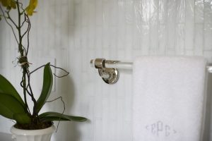 photo of glass and metal bathroom towel bar