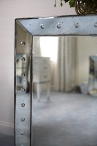 detail photo of metallic edged mirror
