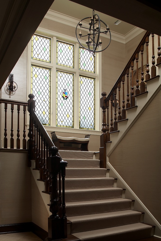 photo of dramatic staircase in front entry way