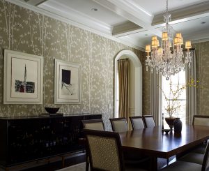 photo of formal dining room with geometric upholstered cream chairs and glass bead chandelier