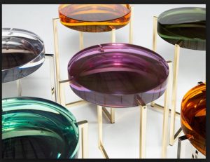 photo of colored glass side tables by Roche Bobois
