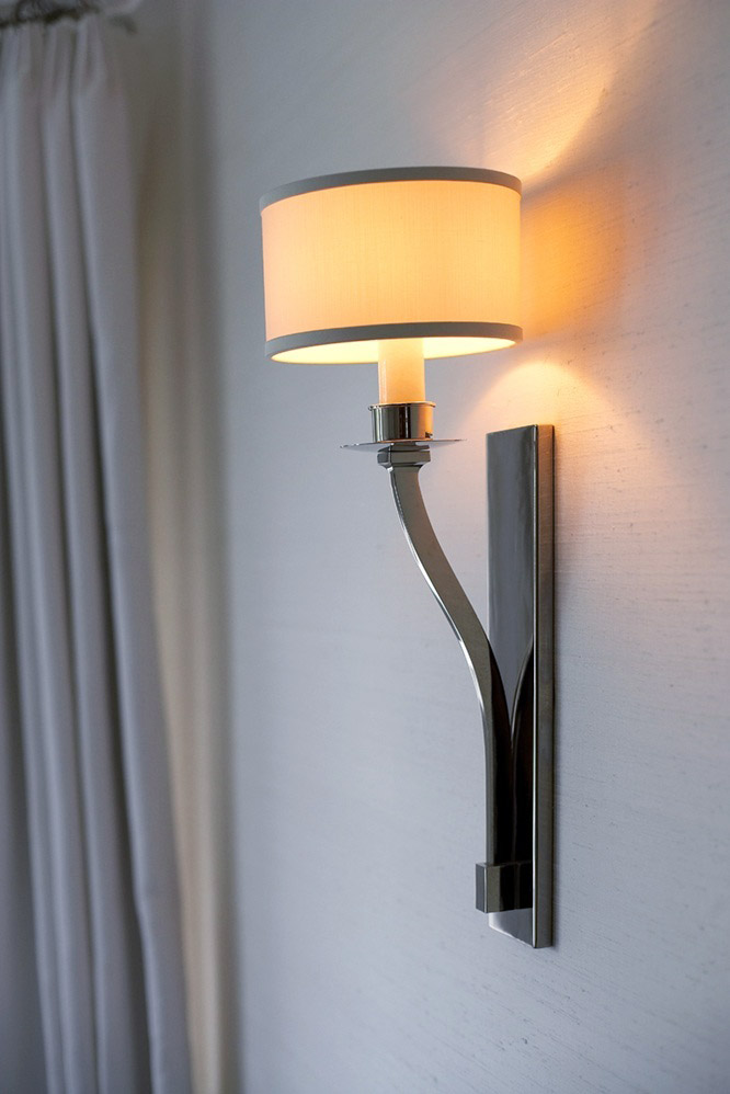 photo of elegant metal wall sconce with circular shade