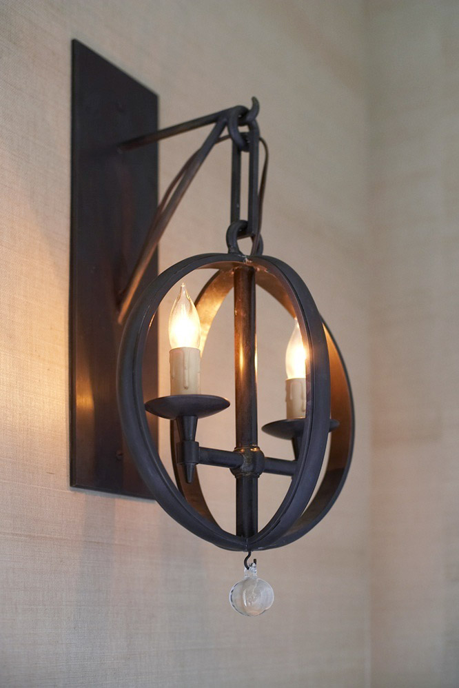 photo of metal sconce with candle light bulbs