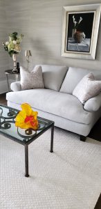 photo of love seat and contemporary art pieces