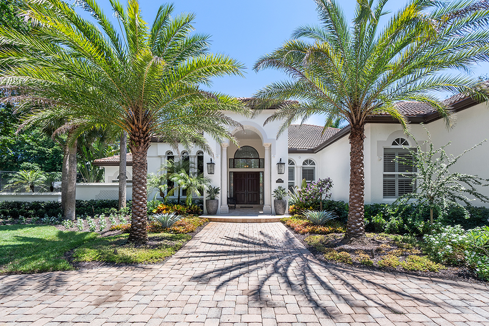 Exterior of Florida home with palm trees