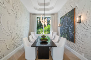 Modern dining room with floral textured wall surface treatment