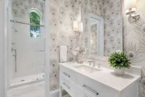 Bathroom suite with feather wallpaper