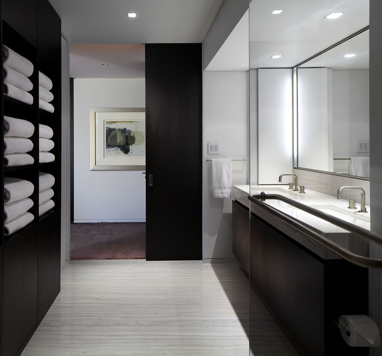 Contemporary sleek Master bath with dark wood and white